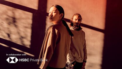two people looking towards the camera, orange tone overlay image number null